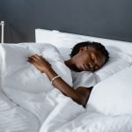 Man sleeping comfortably listening to guided meditation