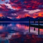 incredible pink sky over mountains and lake