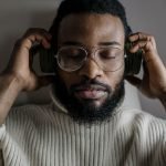 Man putting headphones on